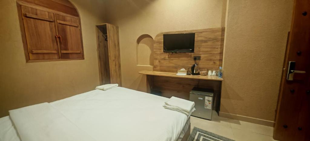 Ένα ή περισσότερα κρεβάτια σε δωμάτιο στο Shwathina Inn نزل شواذنة