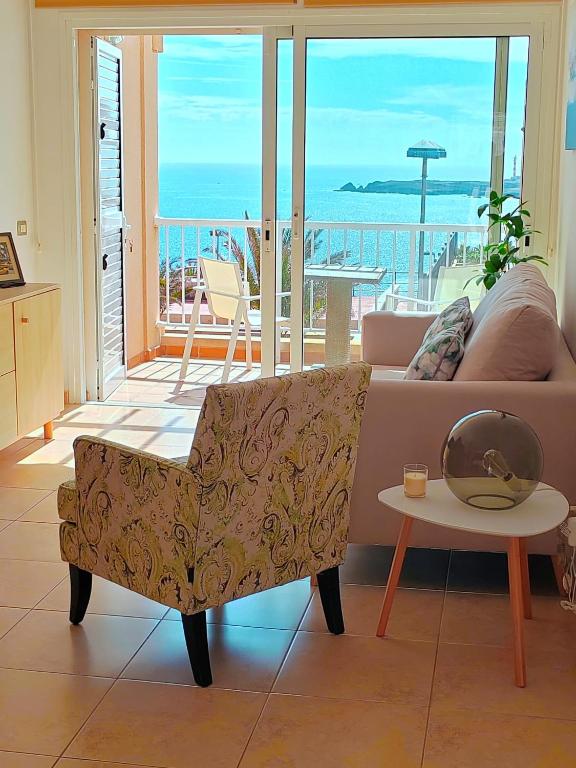 a living room with a couch and a table at Casa Poris in Poris de Abona