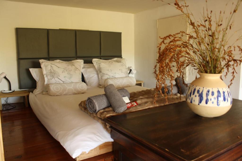 Ένα ή περισσότερα κρεβάτια σε δωμάτιο στο The Potters Hut