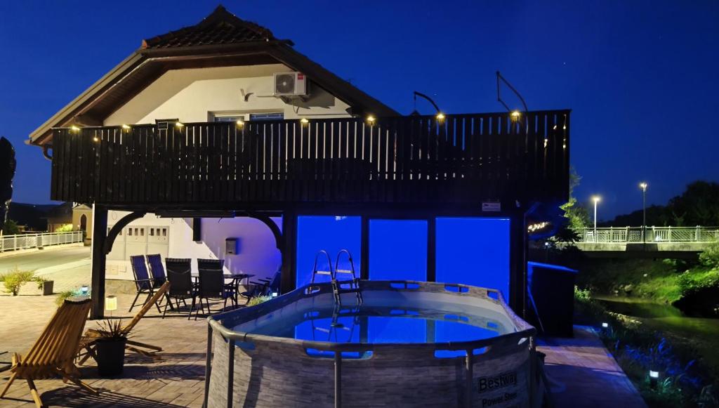 a house with a deck and a hot tub at Apartma Ariana in Loče pri Poljčanah