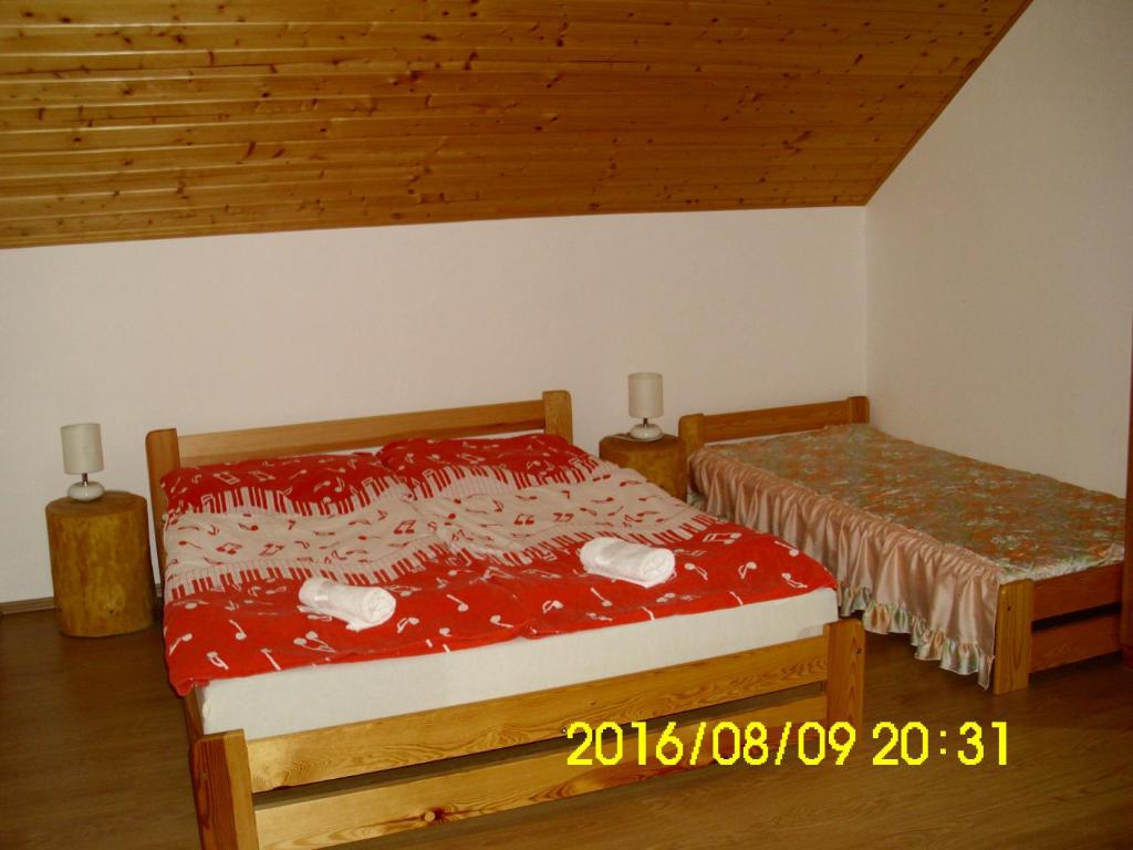 Postel nebo postele na pokoji v ubytování Apartmány nad Otavou