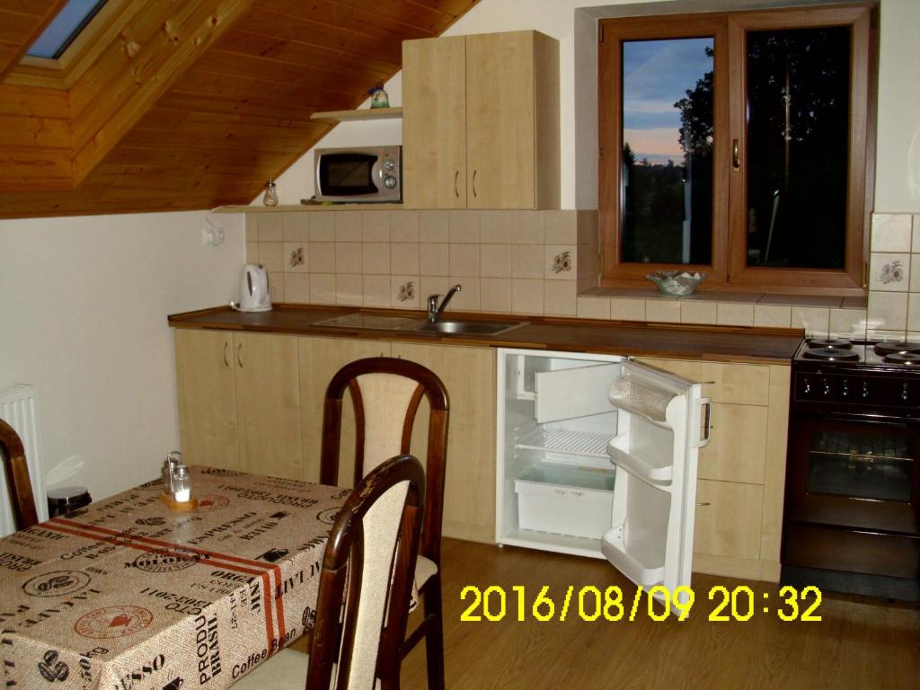 Kuchyň nebo kuchyňský kout v ubytování Apartmány nad Otavou