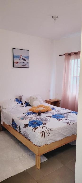a bed sitting in a bedroom with at Apartamento Azul - Bayahíbe in Bayahibe