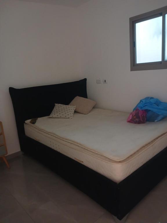 a large bed in a room with at בית רבקה in Nahariyya