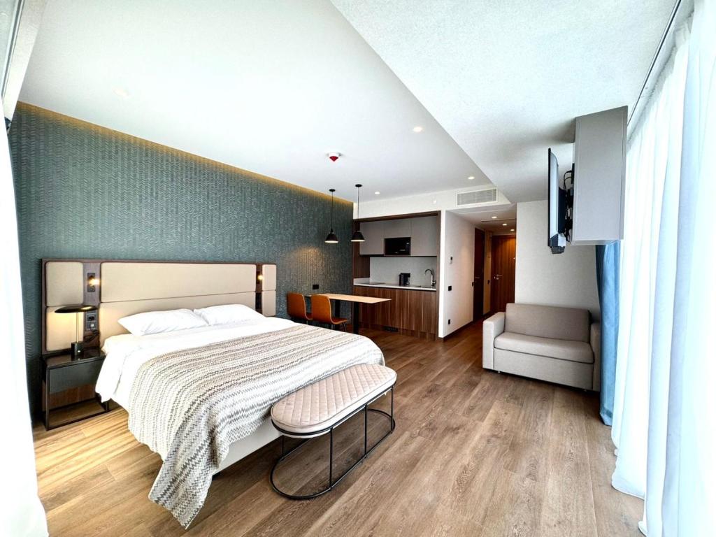 En eller flere senge i et værelse på Sunshine apartments in Alliance Privilege