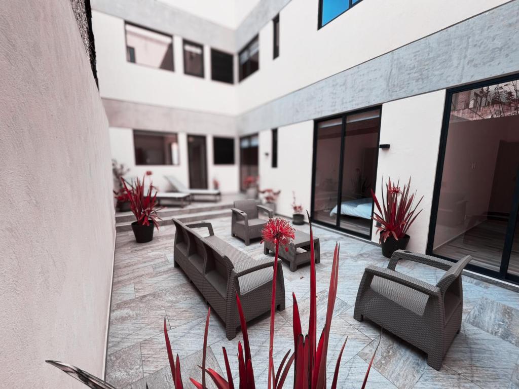 a patio with furniture and plants on a building at Polanco Prime Location Suites - Near Citibanamex in Mexico City