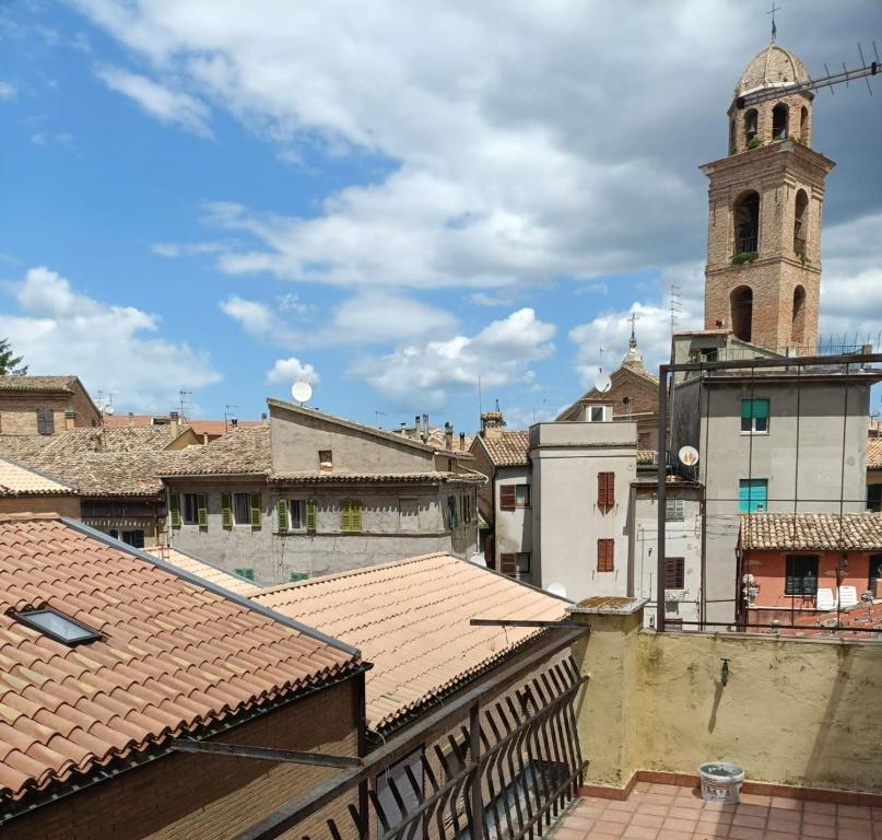 a view of a city with a clock tower at La Gatta sui Tetti in Osimo