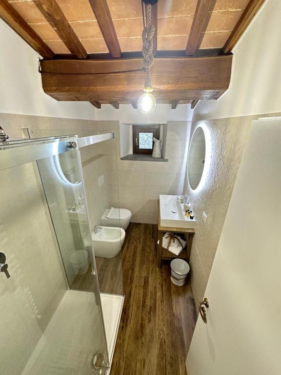 a bathroom with a toilet and a sink and a shower at Under The Tuscan Sun in Arezzo