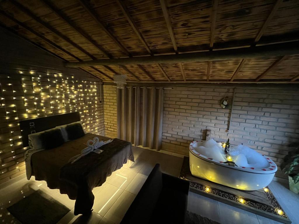 Χώρος καθιστικού στο Chalé Quiosque Família tucano