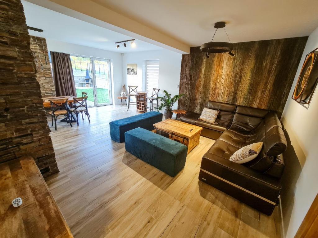 a living room with a couch and a table at Villa Merry in Vysoké Tatry