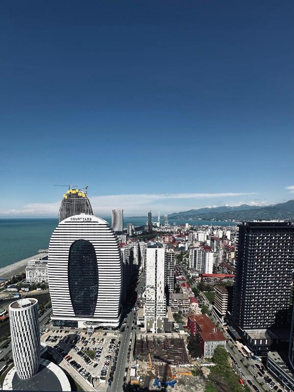 a view of a city with a lot of buildings at Orbi City Hotel D1 Block in Batumi