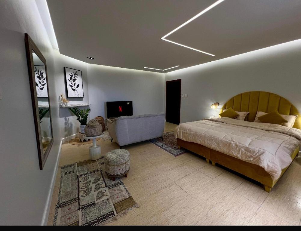 Кровать или кровати в номере استديو النورس 4 - بطراز البوهيمي بـ دخول ذاتي