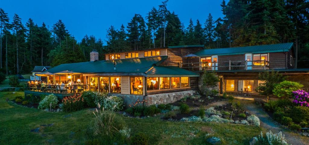 a large house with a lot of windows at The Surf Lodge and Pub in Gabriola