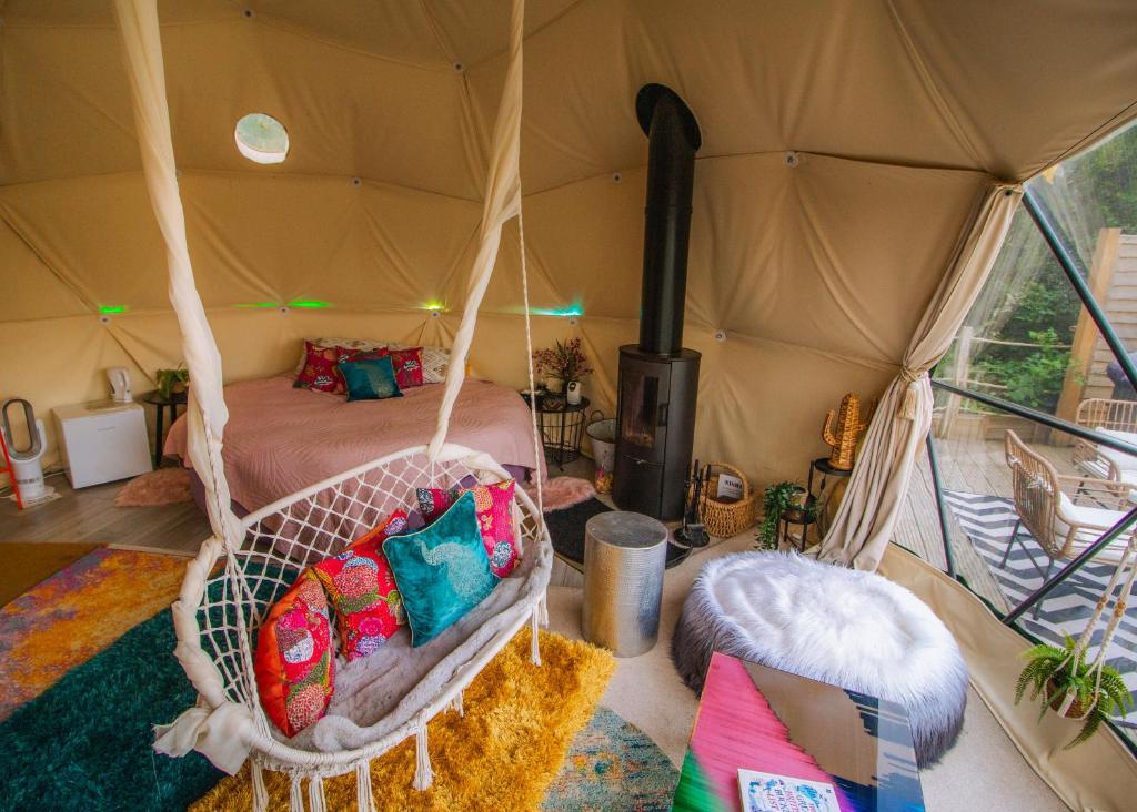 a room with a bed in a tent at Wonderland in Henfield