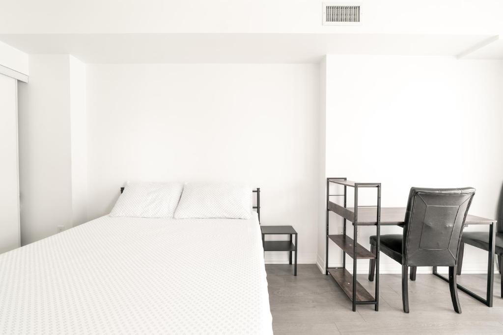 Ένα ή περισσότερα κρεβάτια σε δωμάτιο στο Toronto Downtown Elite Residence