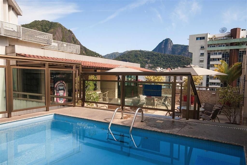 a hotel room with a pool and a swimming pool at Mar Palace Copacabana Hotel in Rio de Janeiro