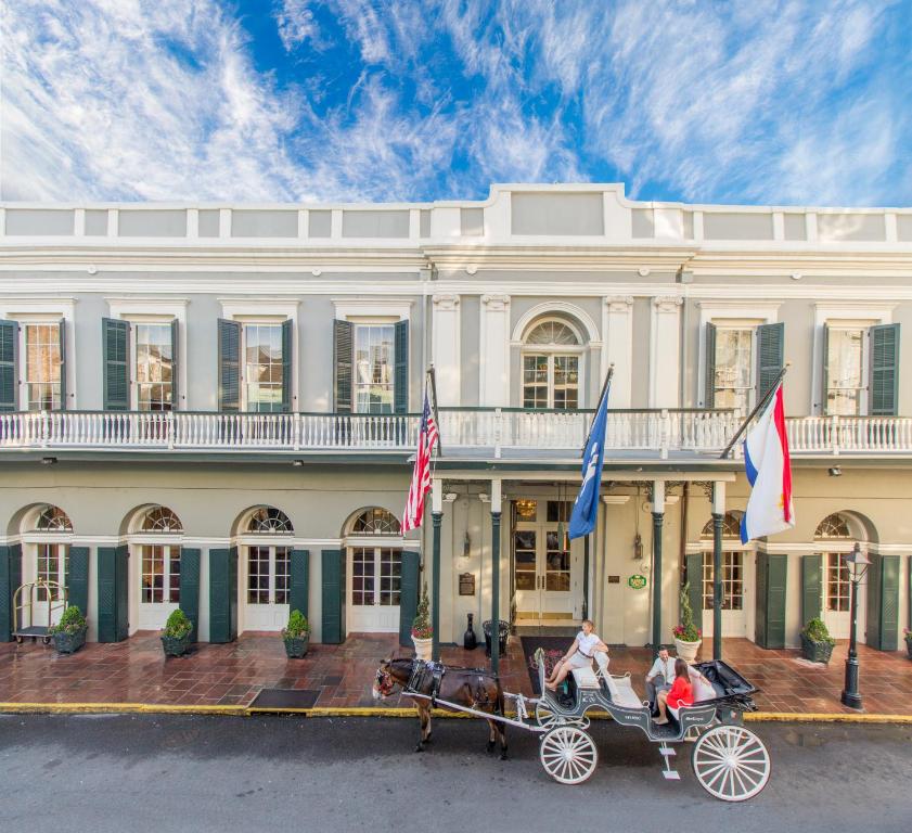 a horse drawn carriage in front of a building at Bourbon Orleans Hotel in New Orleans