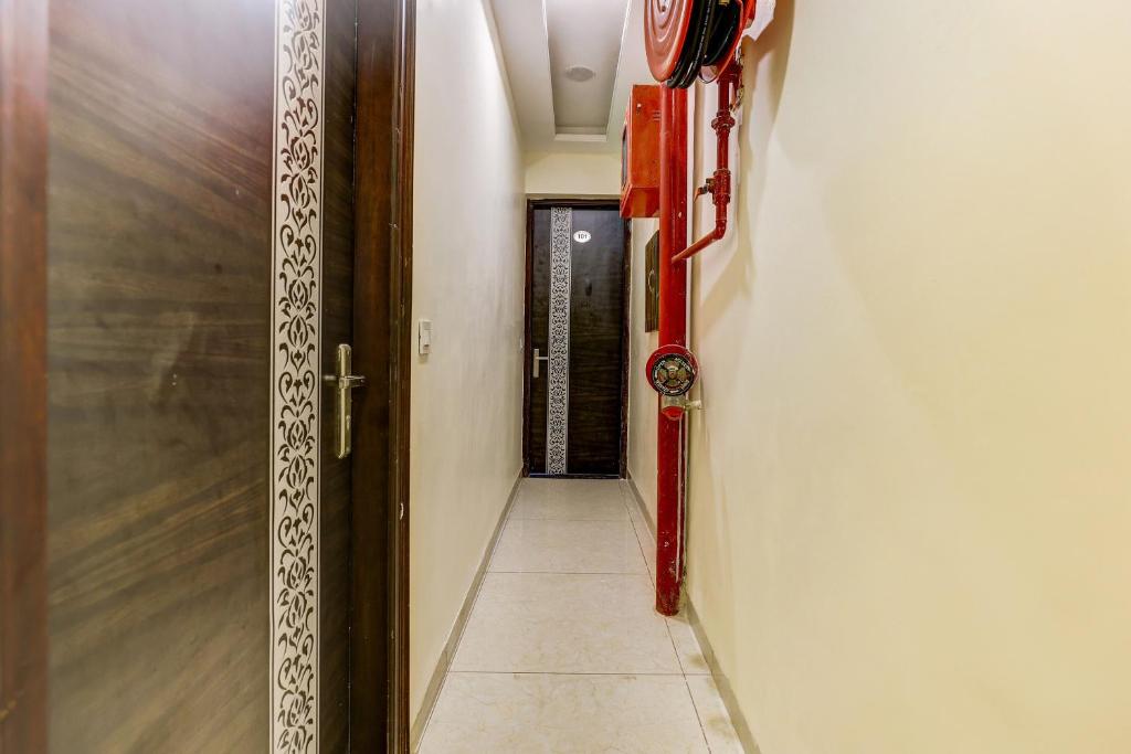 a hallway with a door to a room with a door at Hotel O La Vista in Zirakpur