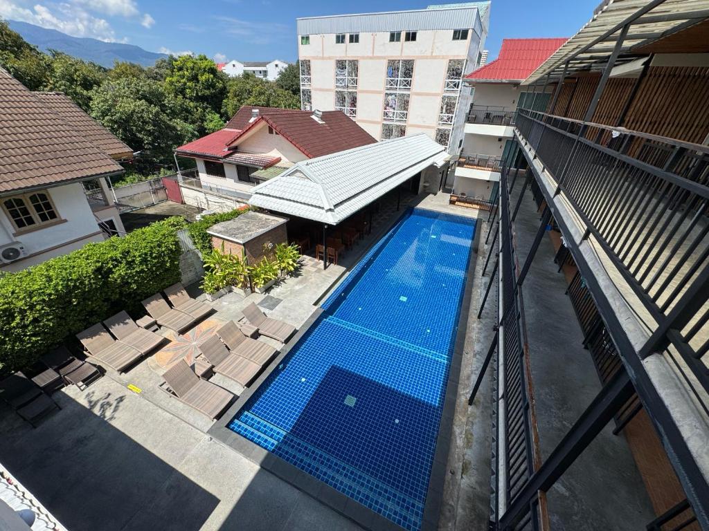 An elevated view shows the long pool courtyard and its surrounding buildings.