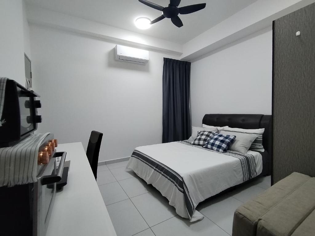 Postel nebo postele na pokoji v ubytování Sinaran Residences