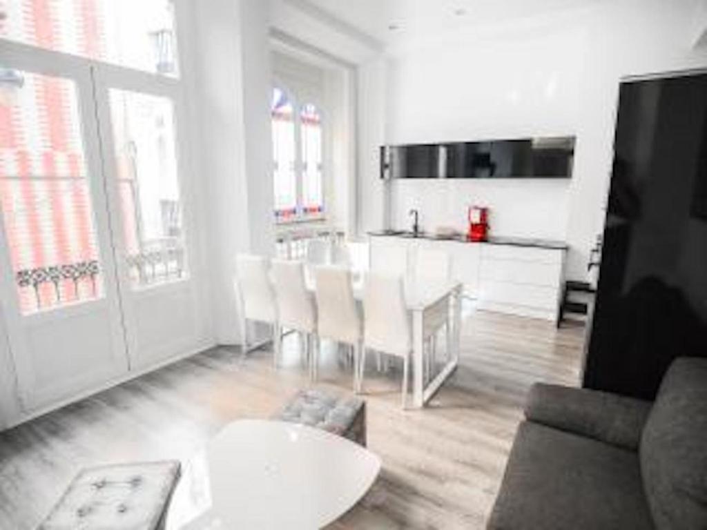 a living room with a couch and a table at Malaga BnB in Málaga