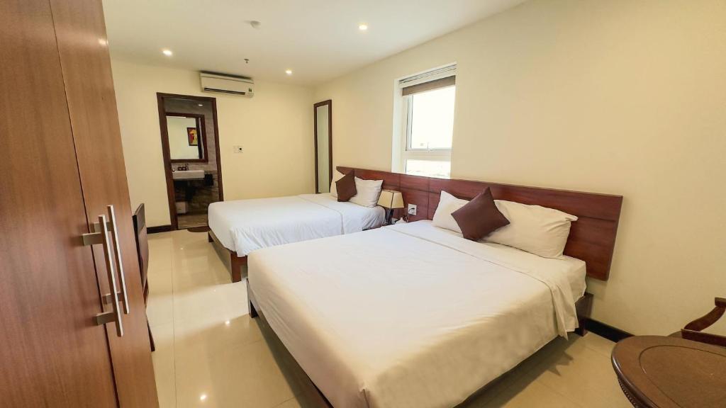 Postel nebo postele na pokoji v ubytování Sujet Center Hotel by Haviland