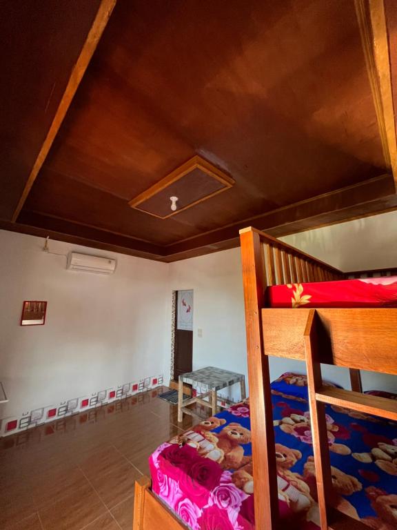 Ένα ή περισσότερα κρεβάτια σε δωμάτιο στο Sumatera Happy Track Tour Guest House