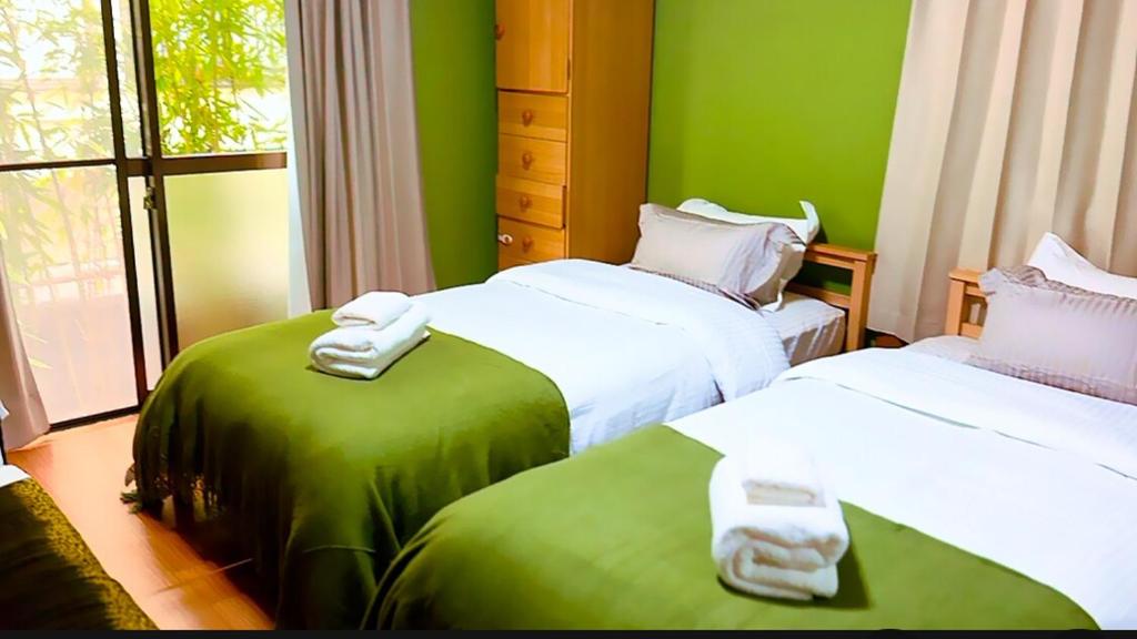 Postel nebo postele na pokoji v ubytování 一隅居