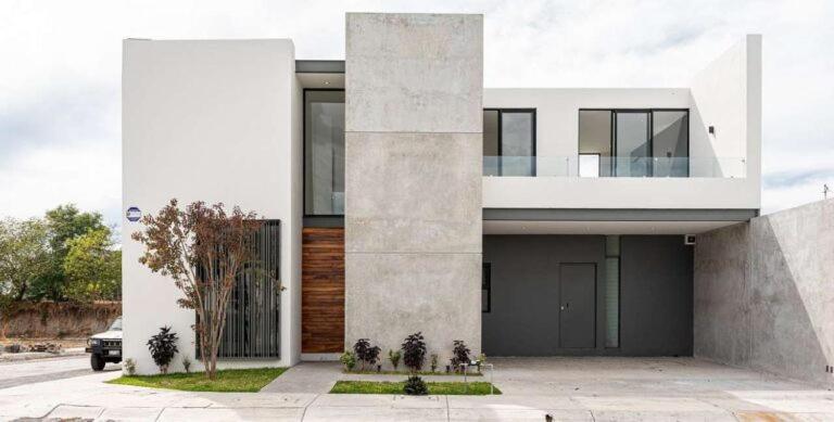 a large white house with a balcony at Intan Vallez Apart in Jambi