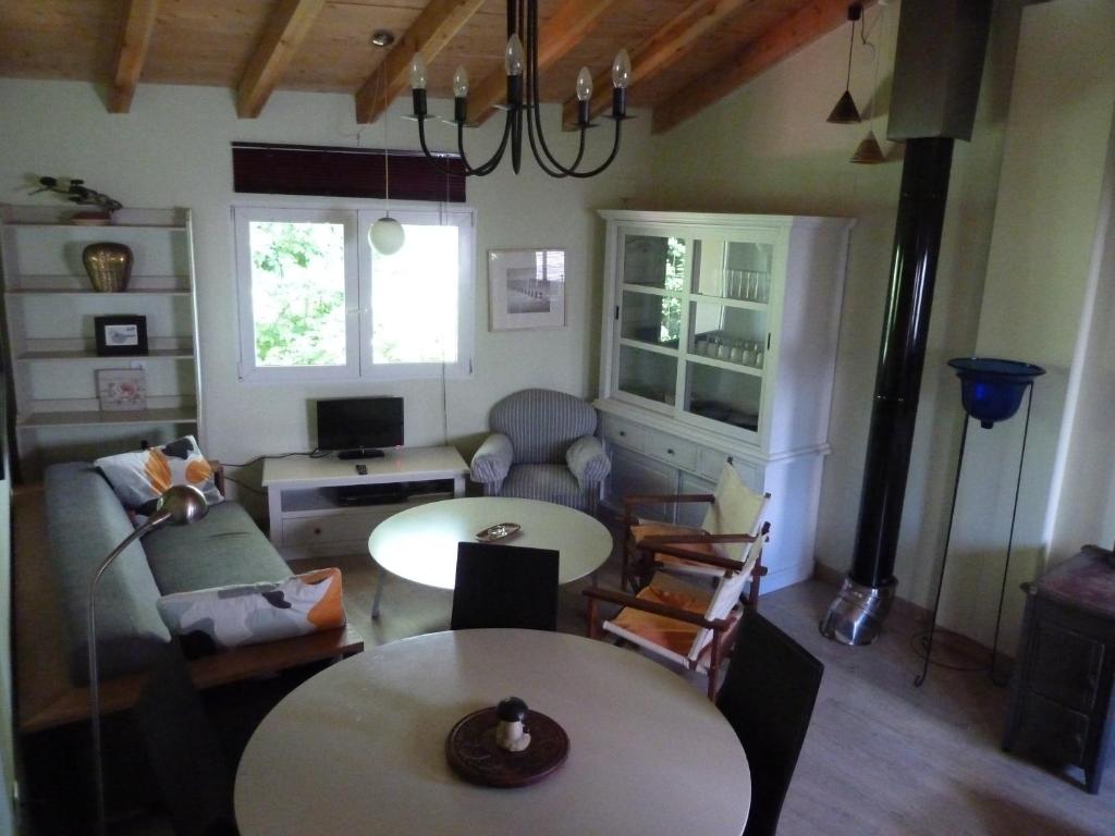 a living room with a couch and a table at El Refugio in La Cueva