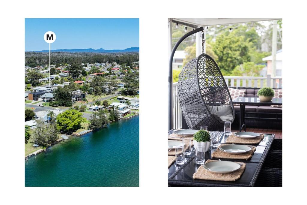 a table on a balcony with a view of a river at Conjola Escapes in Green Island