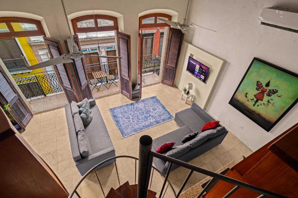 an overhead view of a living room with a couch at Spanish Mansion 4BD Penthouse - Perfect For Family Group in San Juan