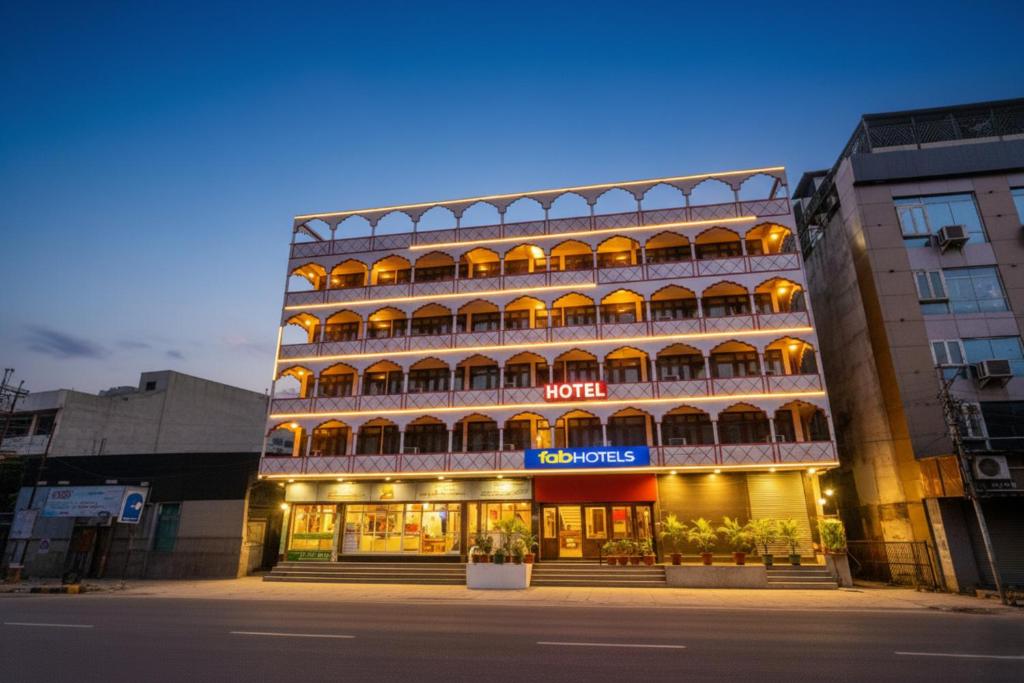 a building with a hotel in front of a street at FabHotel Jai Mangal Palace - Sindhi camp bus stand, Jaipur railway station,Sindhicamp metro station in Jaipur