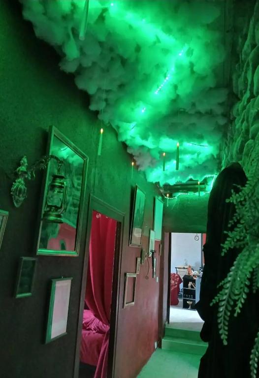 Posezení v ubytování Séjour de sorcier Clim et Jardin