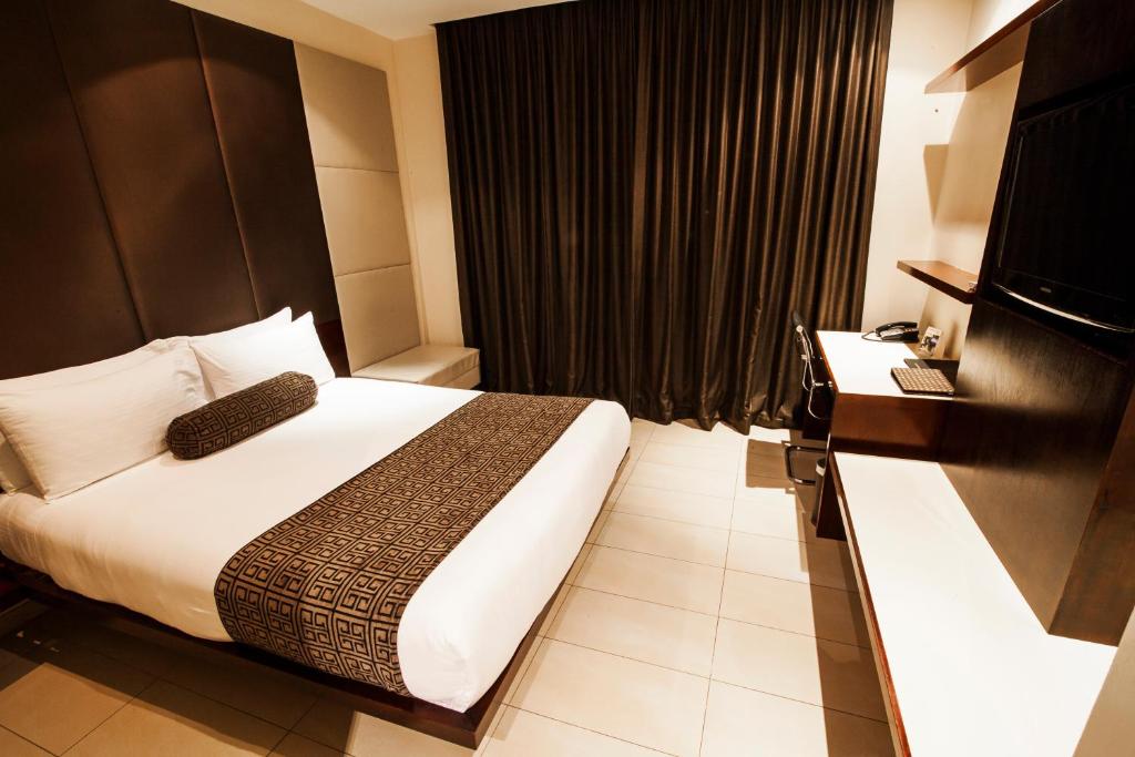 Postel nebo postele na pokoji v ubytování Lamana Hotel