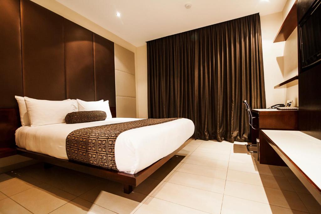 Postel nebo postele na pokoji v ubytování Lamana Hotel