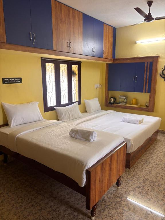 Postel nebo postele na pokoji v ubytování Ram Sethu Home Stay