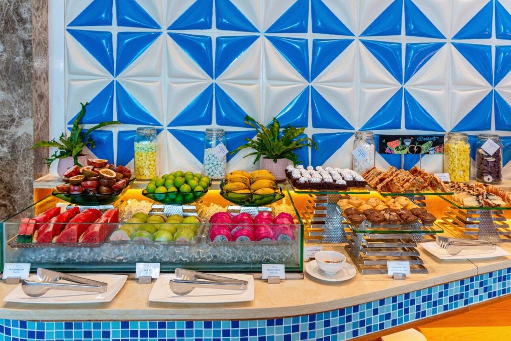 A fruit-forward breakfast buffet with fresh-cut fruit, pastries and cereals.