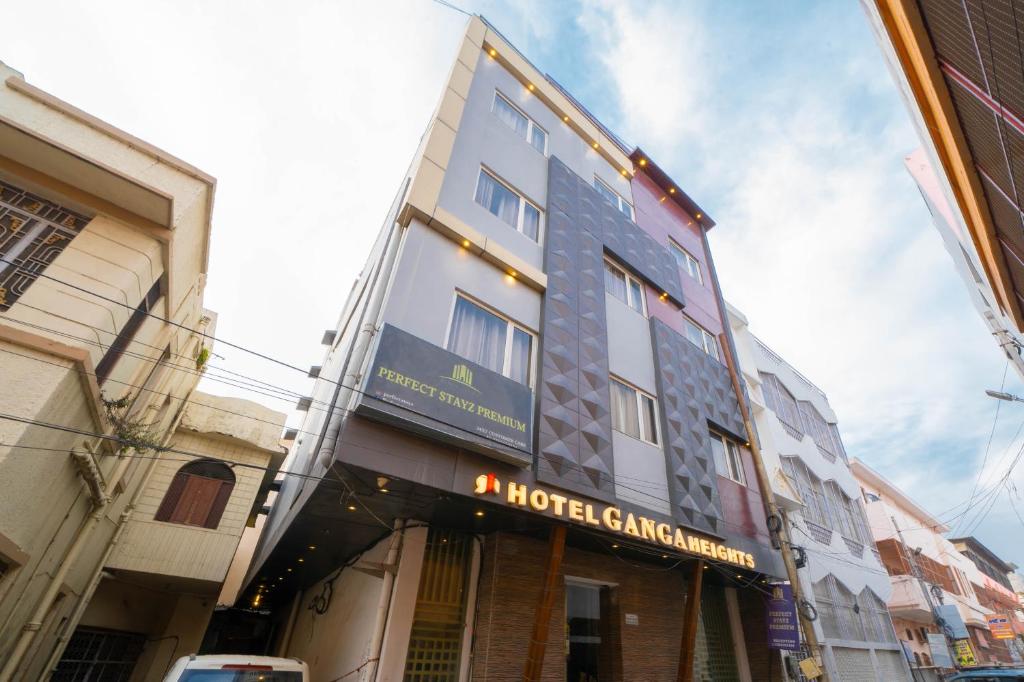 a building with a hotel signage on the side of it at Perfectstayz Premium Ganga Heights - Ganga View rooftop cafe in Haridwār