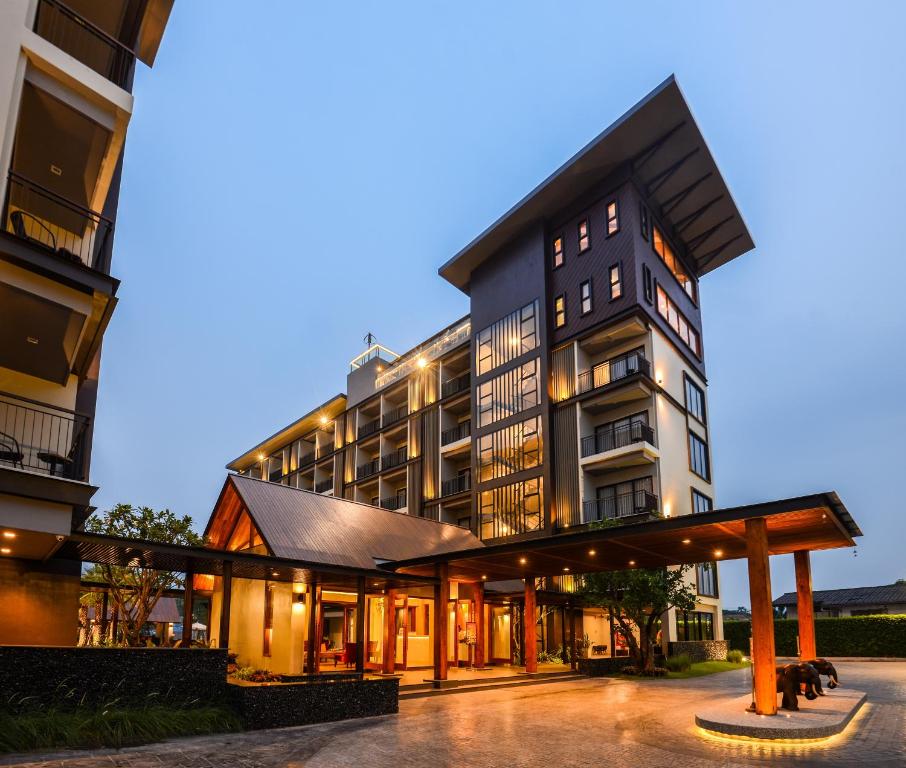 a large building with a lot of windows at Amanta Hotel Nongkhai in Nong Khai