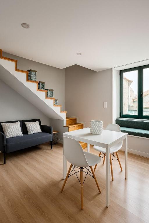 a living room with a white table and chairs at Douro Villa 4 - Best View in Town in Bandeira