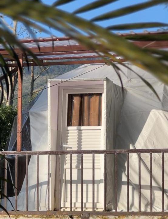 a small white tent with a window in it at Kodai paradise in Dindigul