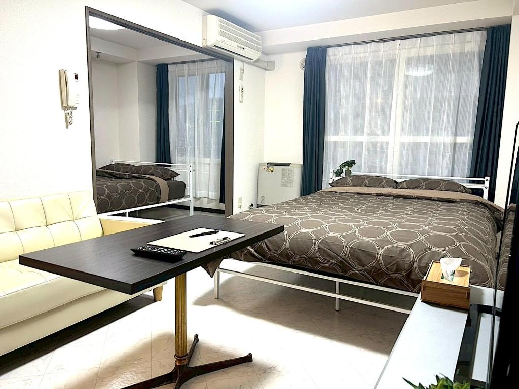 Postel nebo postele na pokoji v ubytování KIYAZA Louvre Sapporo