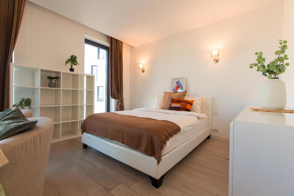 Postel nebo postele na pokoji v ubytování Premium Studio Apartment in Herastrau with City View