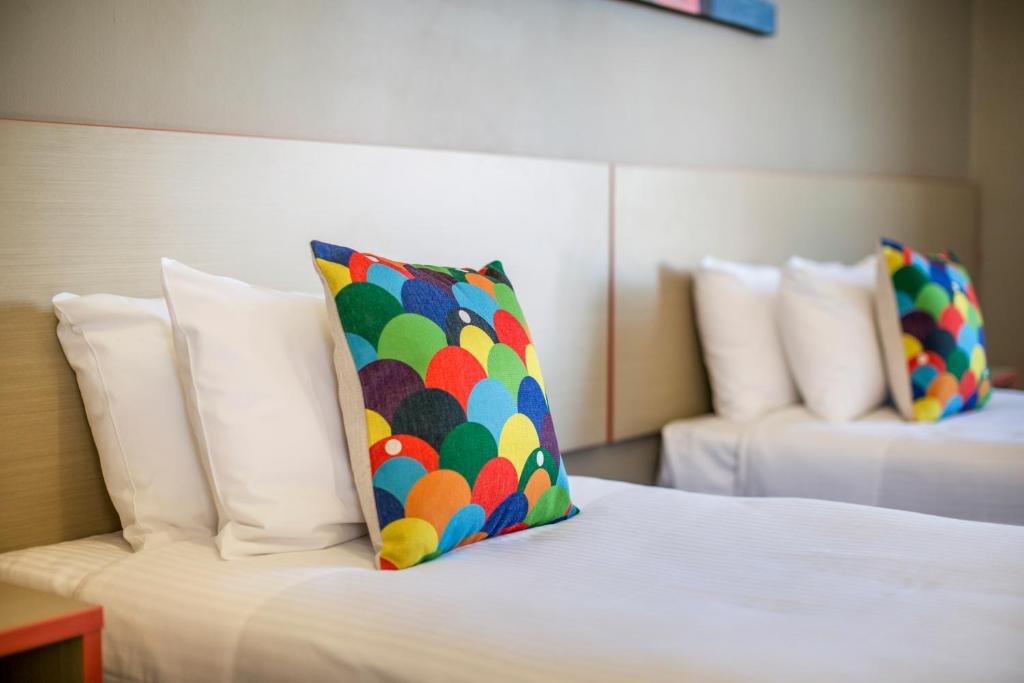 Postel nebo postele na pokoji v ubytování Granville Hotel
