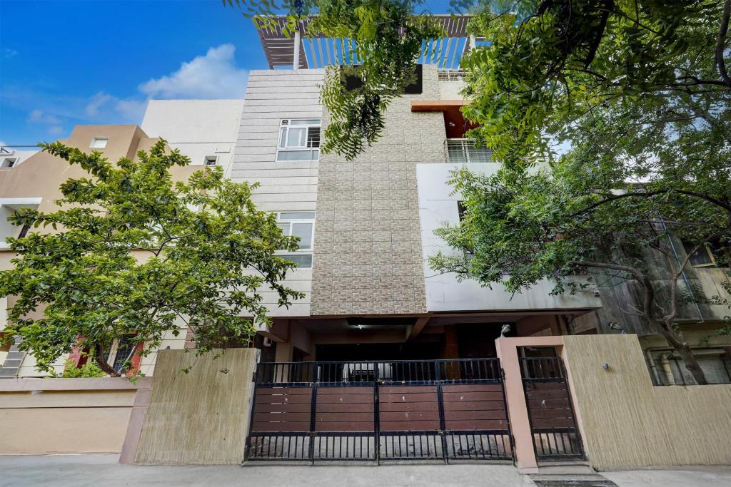 a building with a gate in front of it at Hotel O Ashok Nagar Metro Station Chennai Formerly G Cloud in Chennai