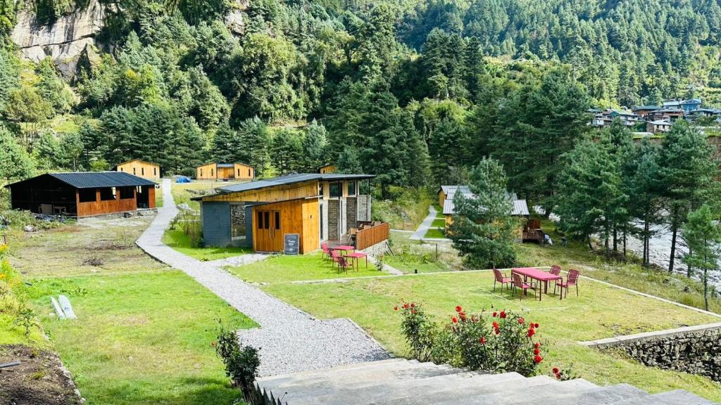 an aerial view of a cabin in a mountain at The Himalayan Phakding in Phakding