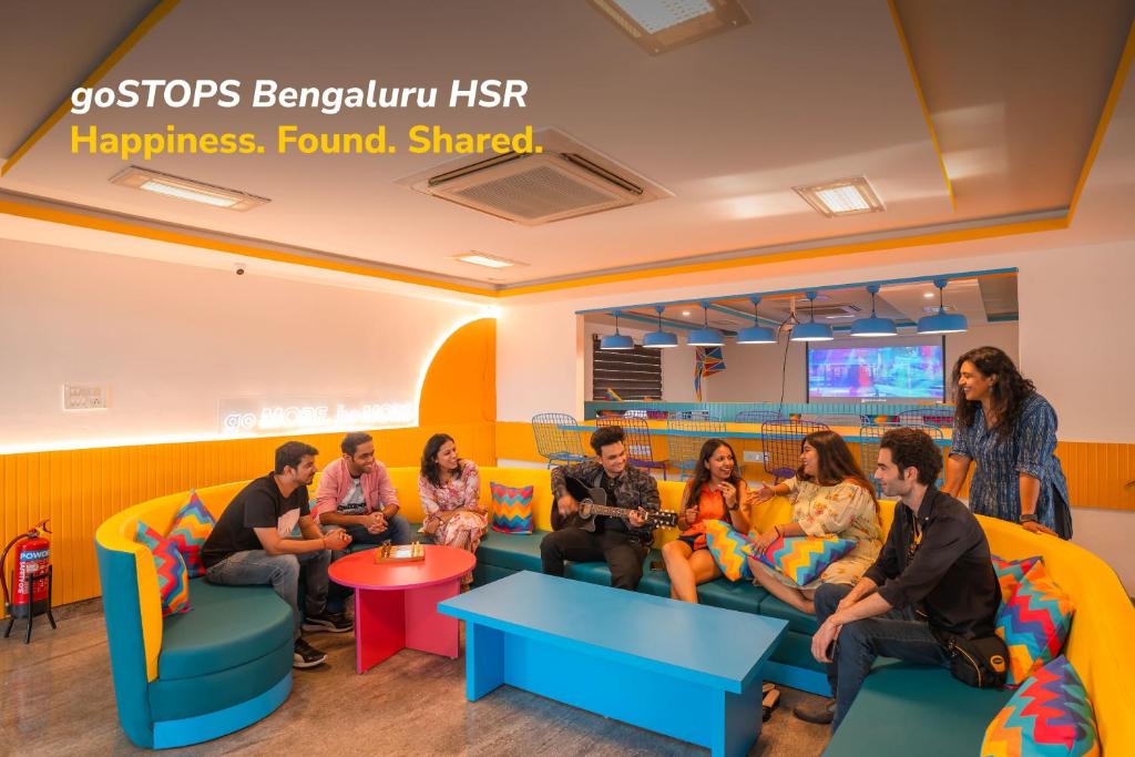 a group of people sitting on a couch in a waiting room at goSTOPS Bengaluru HSR, Silk Board in Bengaluru