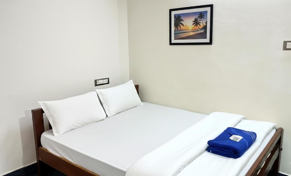 Ένα ή περισσότερα κρεβάτια σε δωμάτιο στο The SERENITY BAY HOME Stay