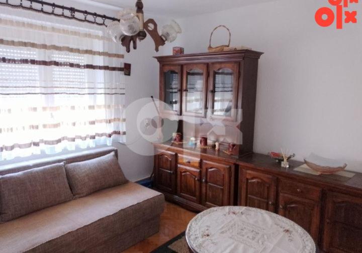 a living room with a couch and a table at Apartman Čeliković in Bosanski Šamac